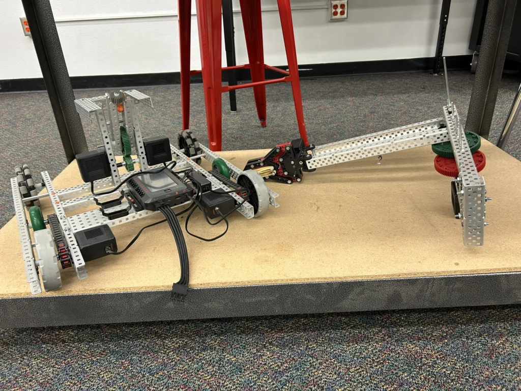 Student-built VEX robot from Sabin Middle School’s redesigned robotics lab, with a square base and gripper arm used for competition challenges.